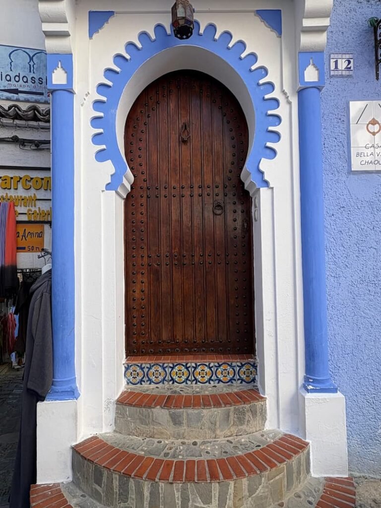 Traditional blue door in Chefchaouen during Custom Morocco Tours with Marrakech First