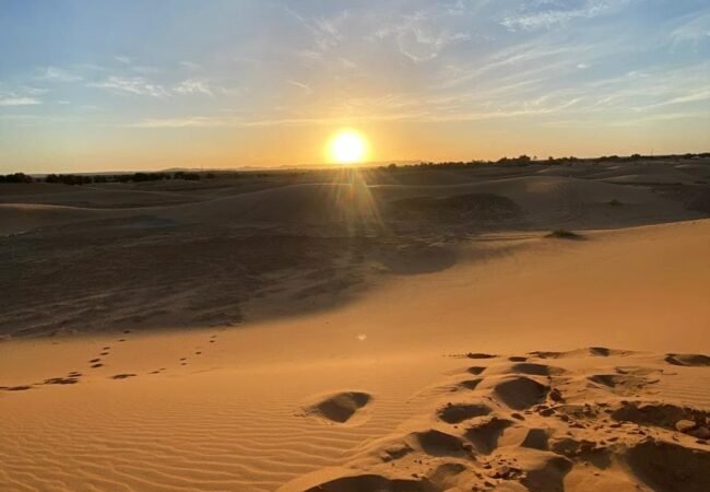 Sahara desert sunset over Erg Chebbi dunes during a 3 days group tour from Marrakech